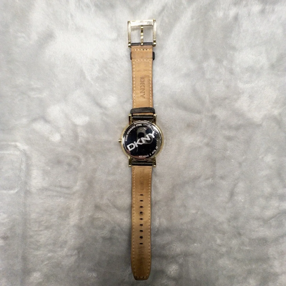 DKNY 111007 Gold Tone All Over Logo Womens 43mm Wristwatch Gem Set Bezel